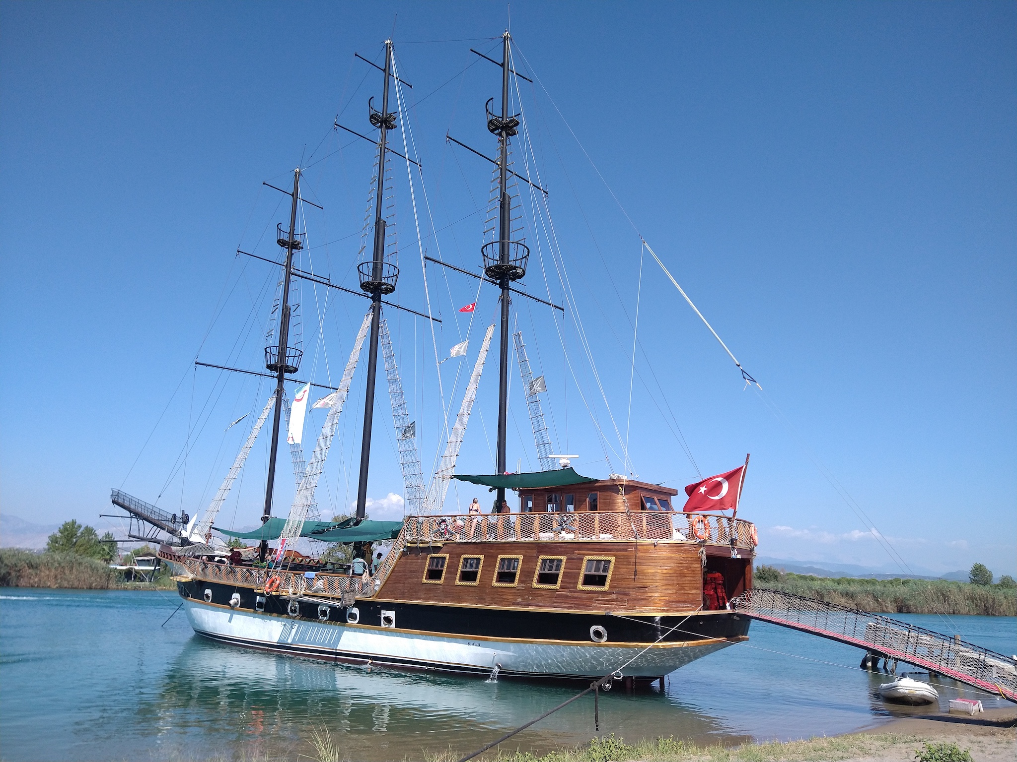 Pirate day cruise ship Barbaros moored on a sand bank. Pirate day cruise ship Barbaros moored on a sand bank.