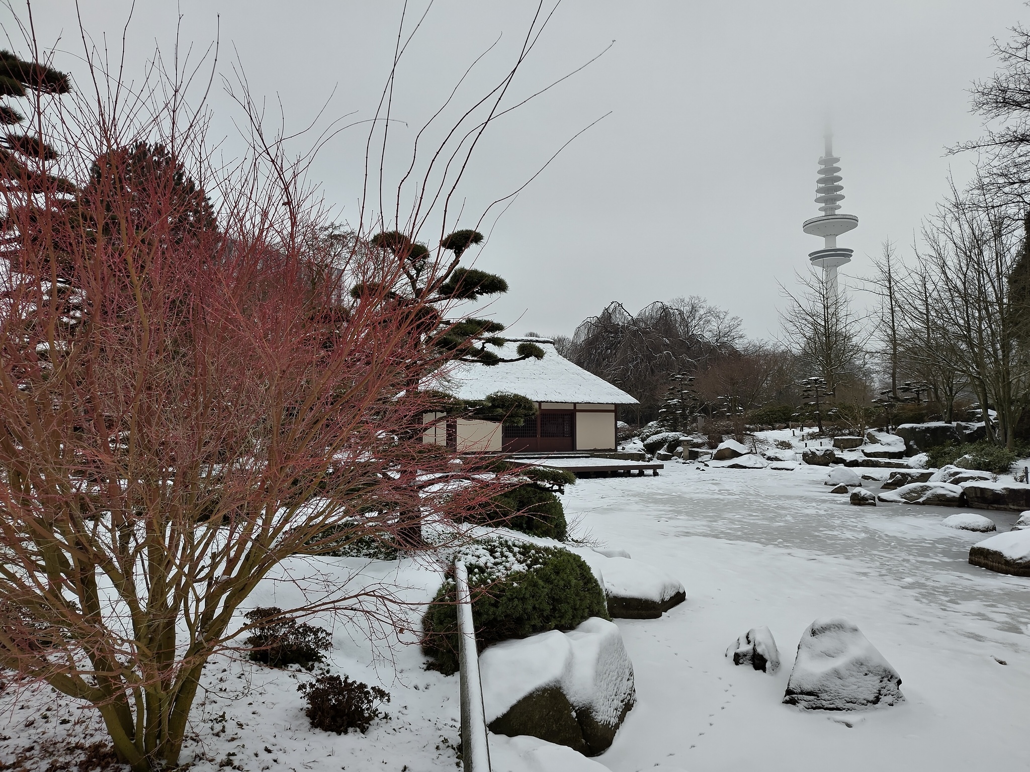 Japanese Gardens Photo of a Japanese Garden, showing a small house, all covered with snow.